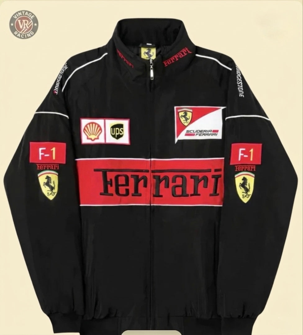 The F1 Vintage Ferrari Racing Jacket - Black Edition features retro-inspired red and white panels, Shell and UPS sponsor patches, F1 emblems, and bold Ferrari text for an authentic motorsport heritage look.