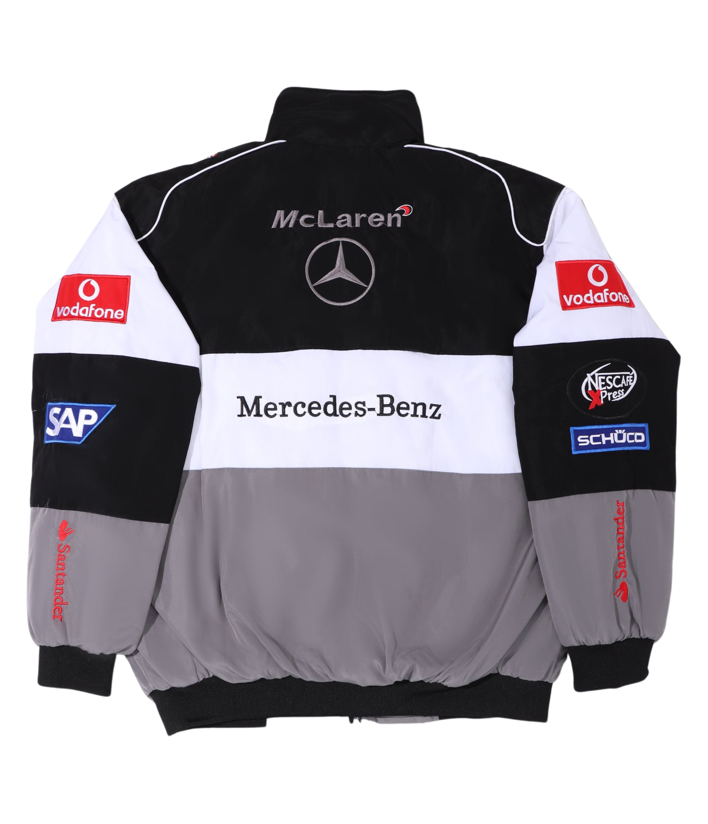 The McLaren F1 x Mercedes-Benz Vintage Jacket sports McLaren and Mercedes-Benz logos on the back, plus Vodafone, SAP, Santander, and Schüco sponsor patches on sleeves and shoulders. Available in classic black, white, and gray.