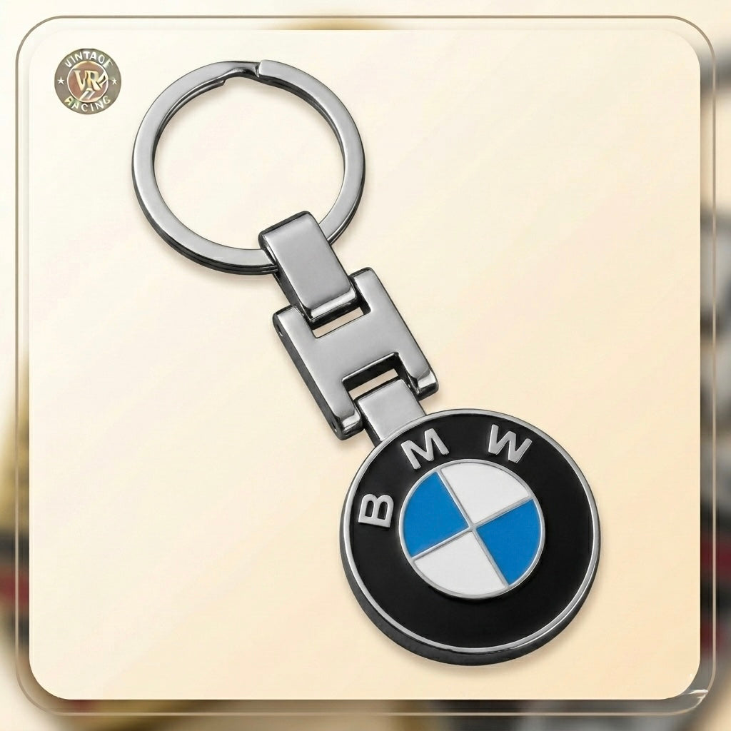 The BMW Keychain features the iconic black, white, and blue BMW roundel on a sturdy keyring. Displayed against a light background, it's perfect for car enthusiasts and fans alike.