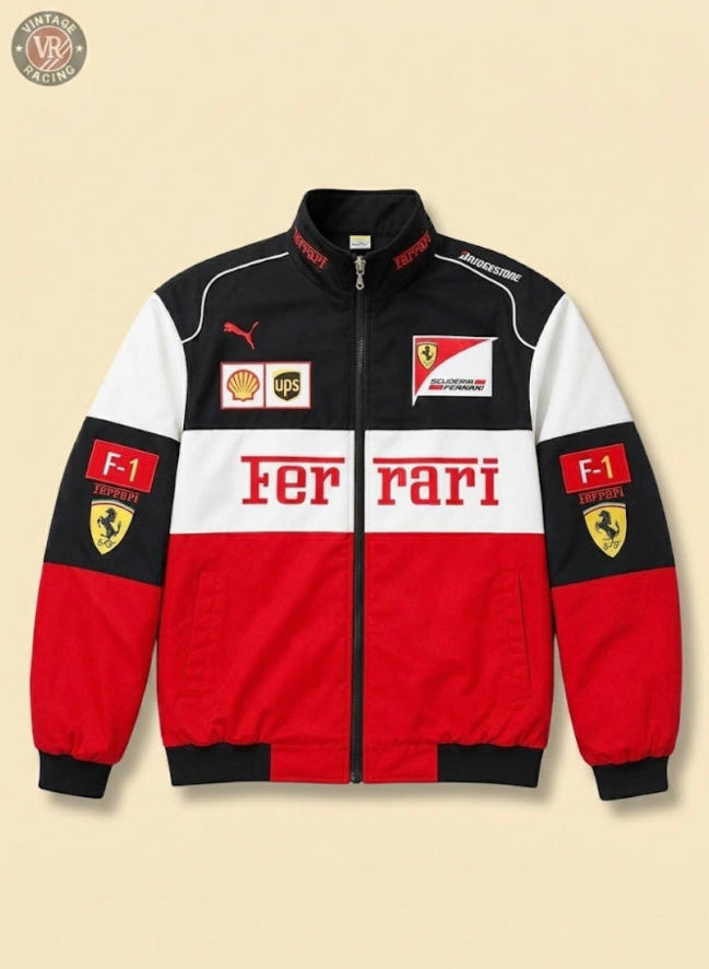 The Ferrari F1 Vintage Jacket - Black & Red Edition, featuring Scuderia Ferrari emblems and F1 details with Puma, UPS, and Shell logos in red, black, and white, is displayed laid flat on a beige background.