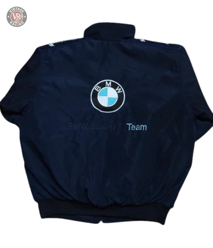 The BMW F1 Vintage Racing Jacket in black features the iconic BMW logo and BMW Sauber F1 Team text on the back, reflecting true racing heritage.