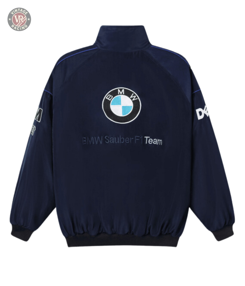 The BMW F1 Vintage Racing Jacket - Classic Edition in navy blue features the iconic BMW logo on the back, embroidered text, and white sleeve logos—a must-have vintage piece for any Formula 1 enthusiast.