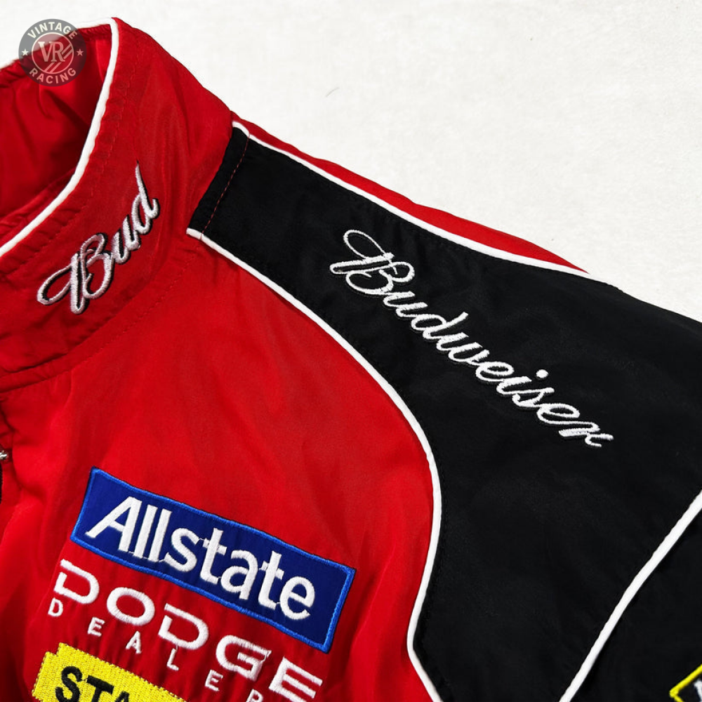 The Budweiser Racing Vintage Jacket - NASCAR Red Edition showcases embroidered Bud and Budweiser logos, with Allstate and Dodge Dealers patches—capturing classic vintage motorsport jacket style.