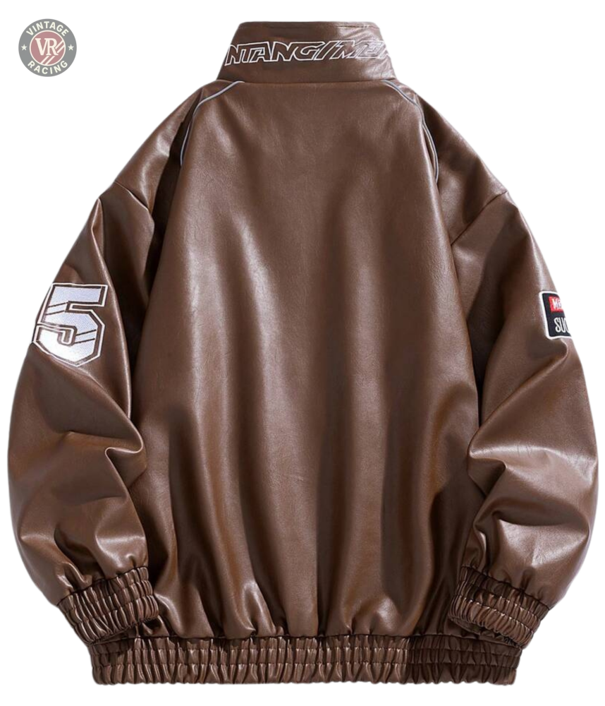 The LAP 85 Brown Racing Jacket channels an 80s driver vibe with a back view, elastic cuffs and waistband, white 5 on one sleeve, text patch on the other, and MUSTANG across the collar—a true vintage motorsport look.