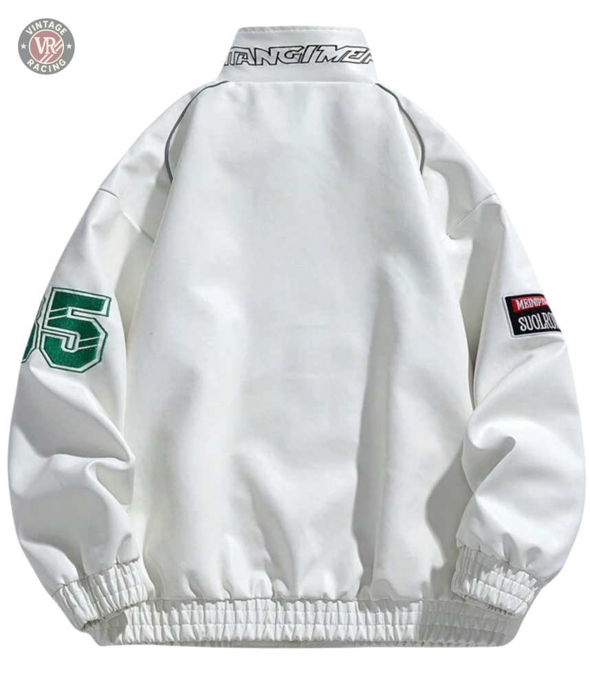 The LAP 85 White Racing Jacket features green 95 text on the left sleeve, a “MOMENT SOULCHAOS” patch on the right sleeve, and stylized collar lettering—a bold retro design with standout streetwear appeal.