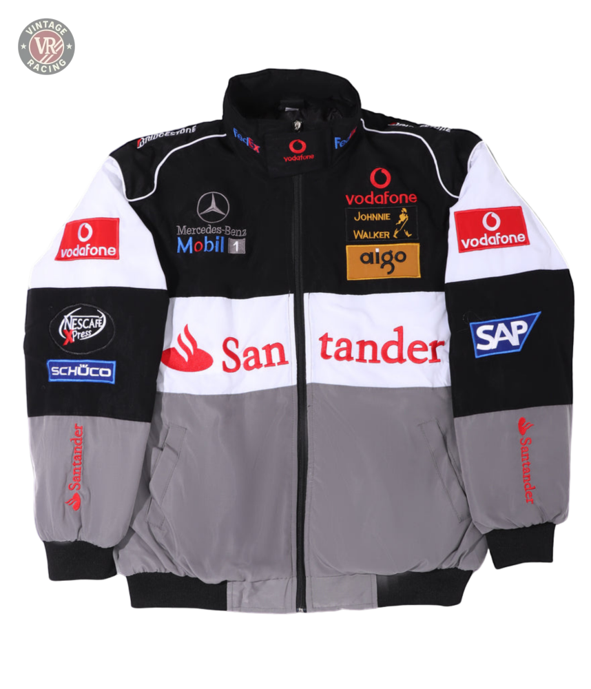 The McLaren F1 x Mercedes-Benz Vintage Jacket features black, white, and gray panels with Vodafone, Santander, SAP, Johnnie Walker, and Mercedes-Benz sponsor logos on the front, sleeves, and shoulders—a must-have for retro Formula 1 fans.