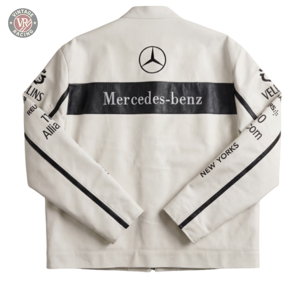 The Mercedes Vintage Racing Leather Jacket - White features black stripes, the Mercedes-Benz logo and text on the back, plus sponsor logos on the sleeves. Shown laid flat against a neutral backdrop.