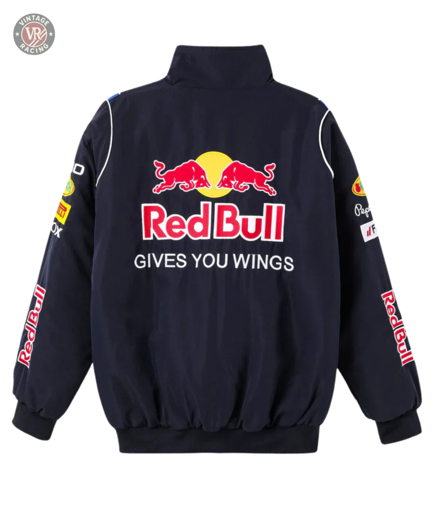 The Red Bull Racing F1 Jacket is black and features the iconic logo, two red bulls, GIVES YOU WINGS on the back, plus sponsor logos on the sleeves and shoulders—perfect for F1 fans to show their passion.