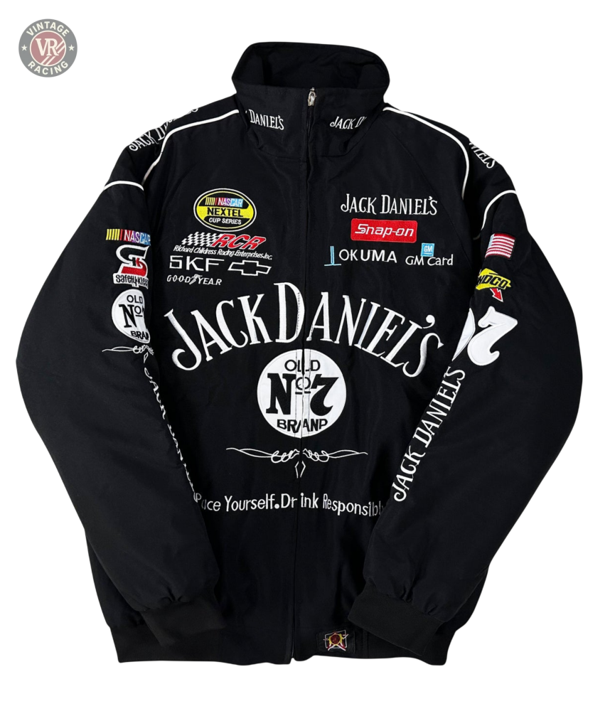 The Sponsored’s Racing Vintage Jacket showcases assorted sponsor logos and patches in white, red, and yellow, with the main Jack Daniels Old No. 7 Brand logo boldly featured on the front and sleeves for striking motorsport style.