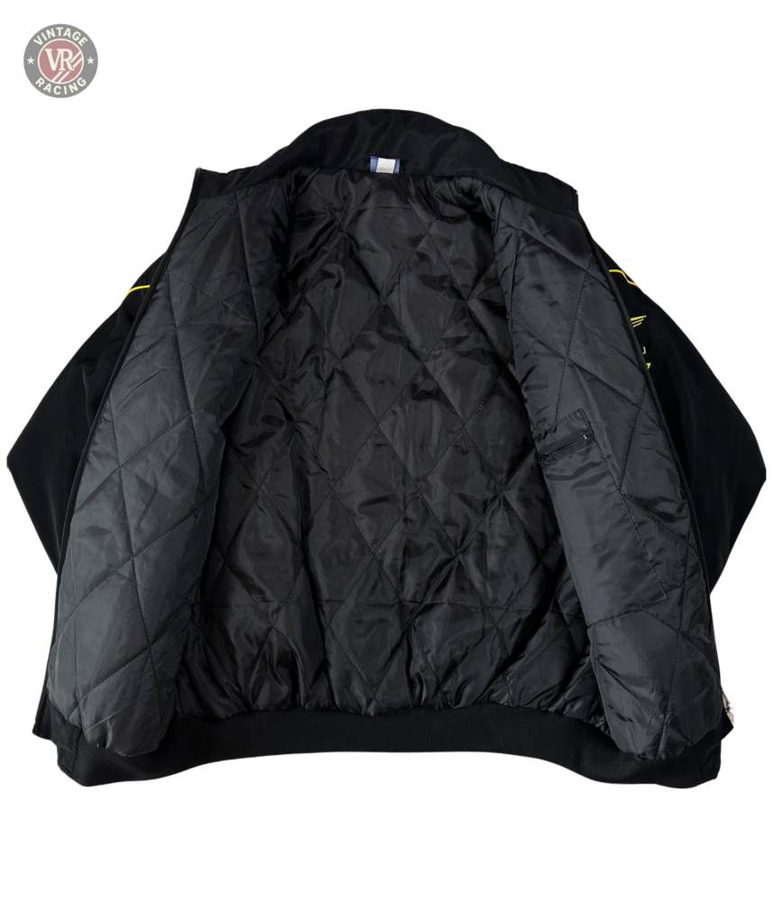 The Subaru Rally Vintage Racing Jacket is displayed open on a white background, showcasing its quilted diamond-pattern lining and classic rally heritage style.