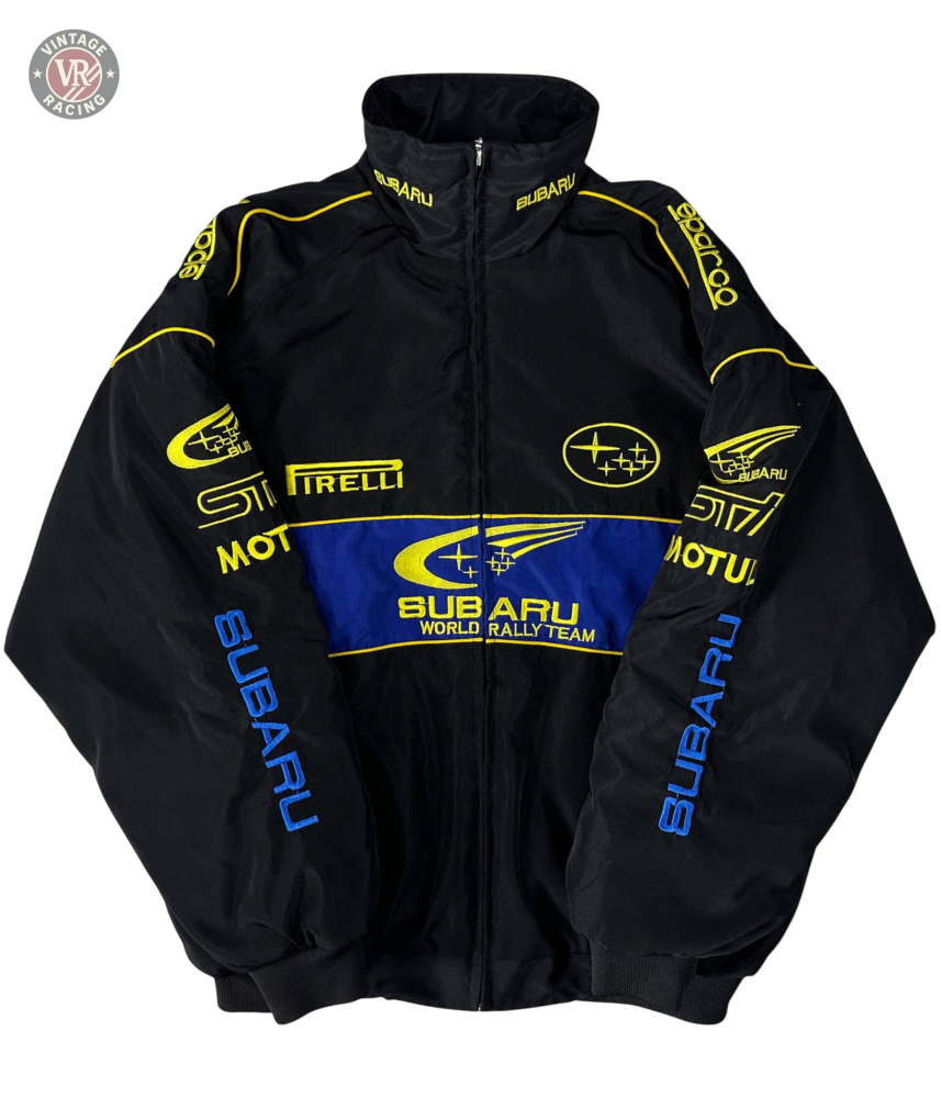 The Subaru Rally Vintage Racing Jacket is a black jacket with bold yellow and blue STI, Pirelli, Motul, and SUBARU logos on the front, sleeves, and shoulders—a vintage piece that proudly celebrates rally heritage.