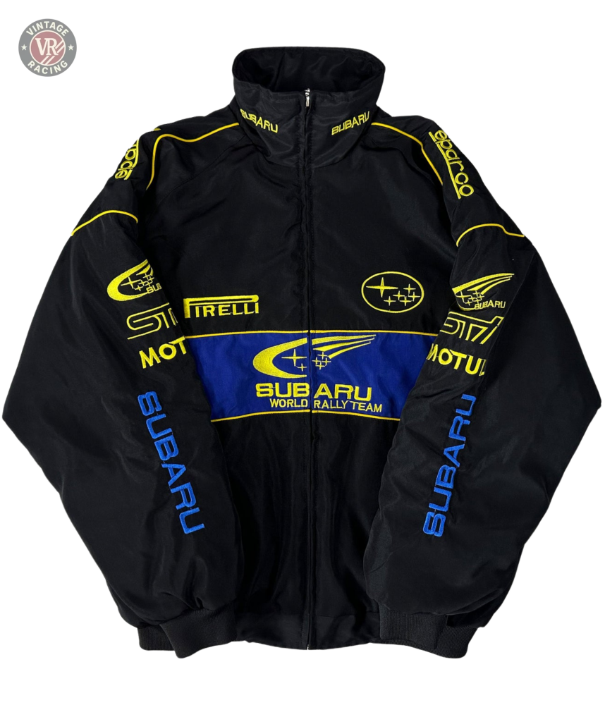 The Subaru Rally Vintage Racing Jacket is a black jacket with bold yellow and blue STI, Pirelli, Motul, and SUBARU logos on the front, sleeves, and shoulders—a vintage piece that proudly celebrates rally heritage.