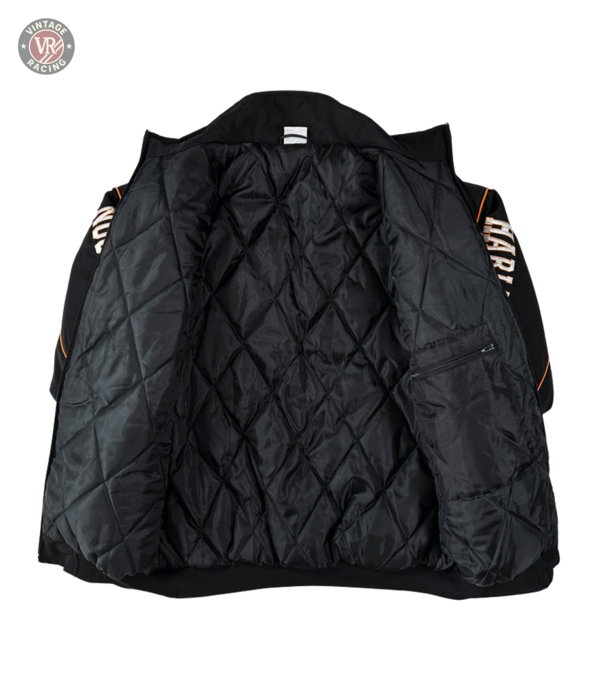 The Vintage Harley Davidson Jacket, shown open, reveals a diamond-patterned lining and a small left zip pocket. Its black quilted sleeves feature bold orange and white text, reminiscent of classic retro motorcycle jacket style.