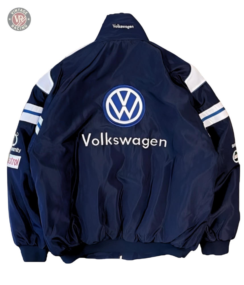The Volkswagen Vintage Racing Jacket features a navy blue design with white sleeve stripes, sponsor patches, and a large Volkswagen logo and text on the back—ideal for fans of retro automotive or classic motorsport style.