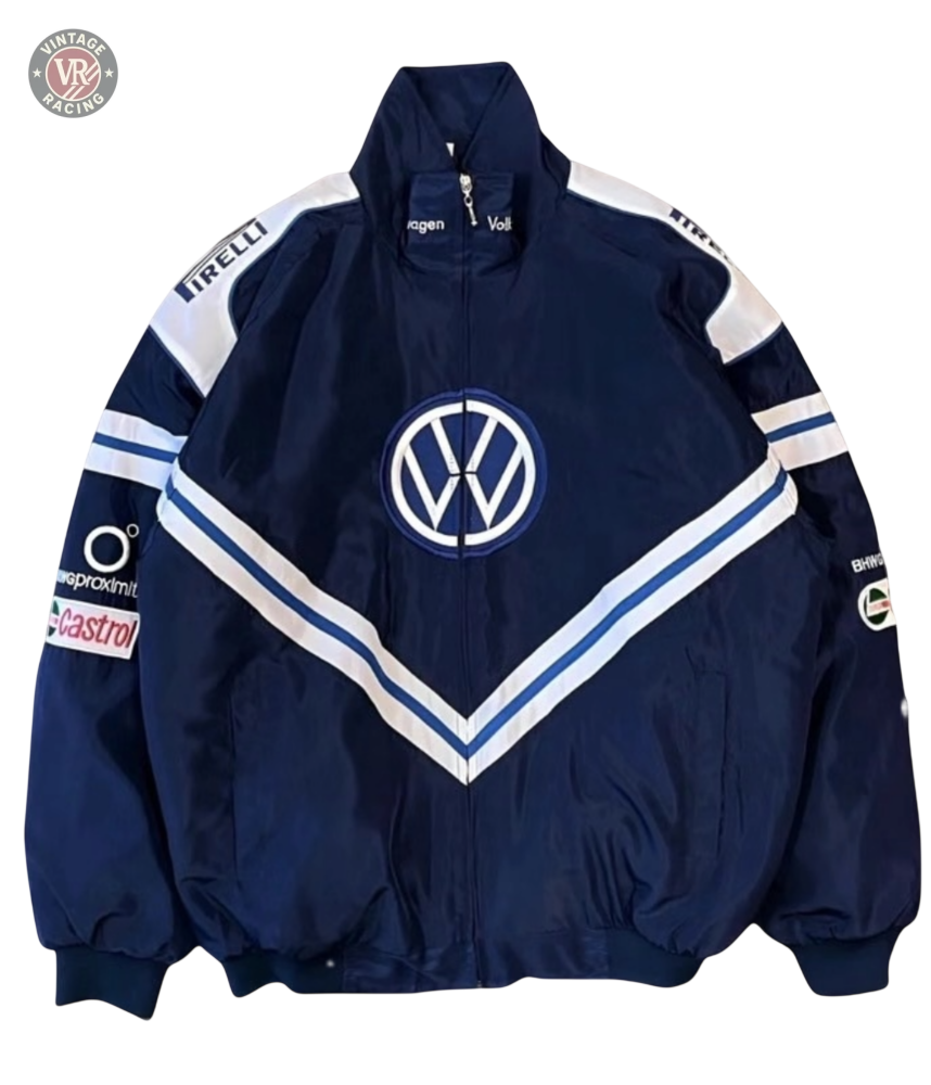 The Volkswagen Vintage Racing Jacket in navy blue features a front logo, white and blue V-stripes, and sponsor badges like Pirelli and Castrol—a must-have for retro automotive and motorsport enthusiasts.