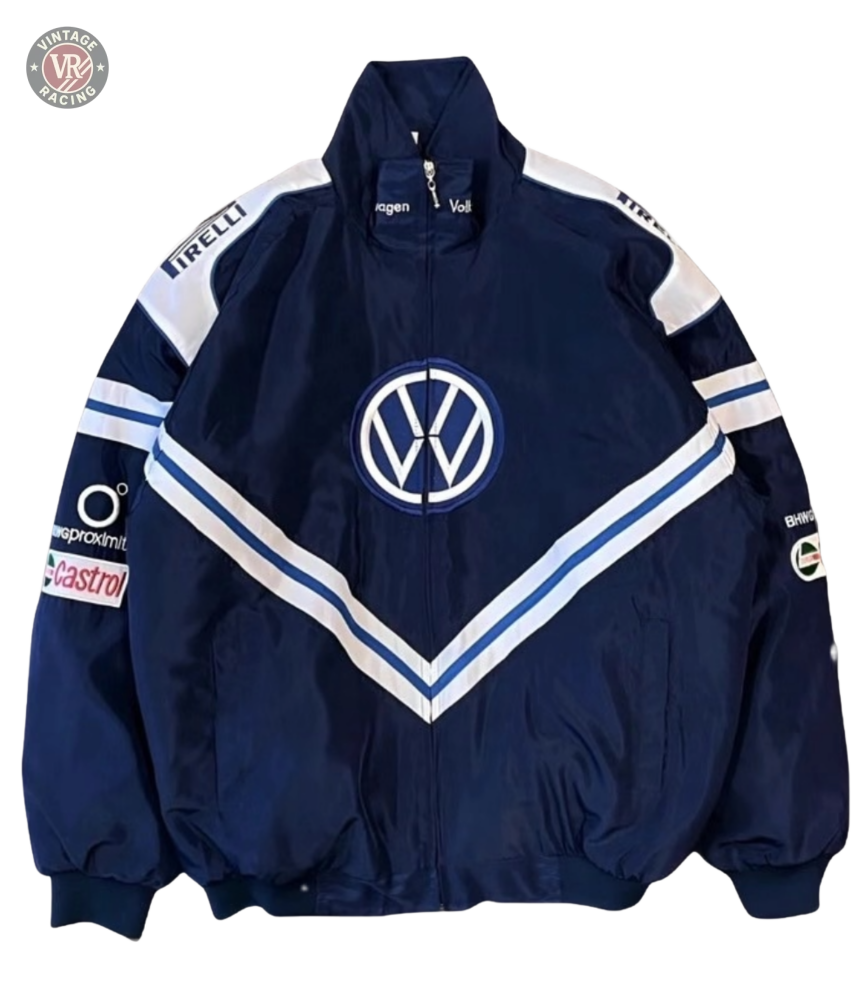 The Volkswagen Vintage Racing Jacket in navy blue features a front logo, white and blue V-stripes, and sponsor badges like Pirelli and Castrol—a must-have for retro automotive and motorsport enthusiasts.