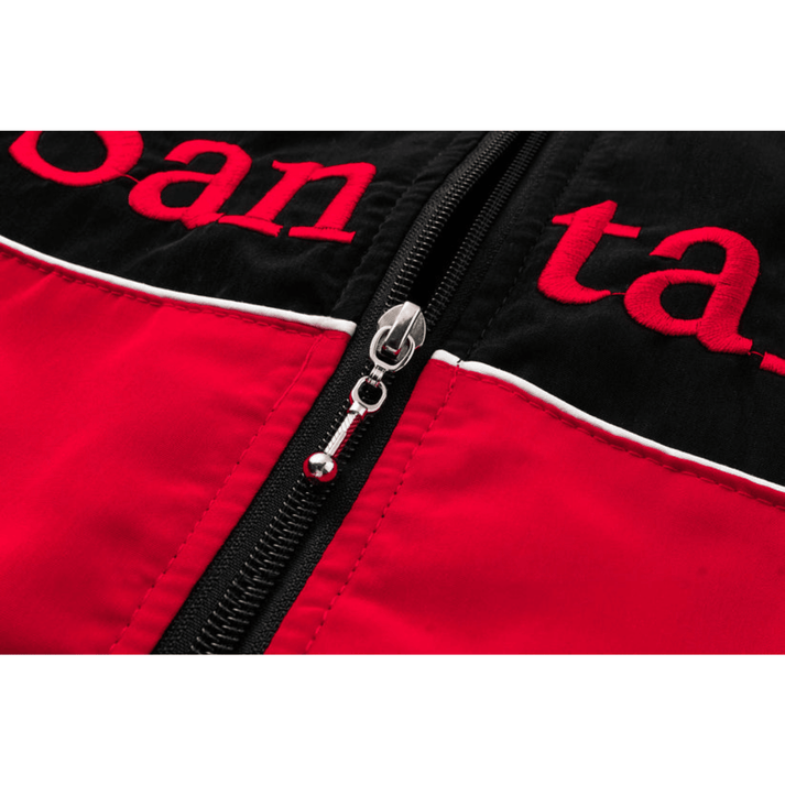 Close-up of the McLaren x Mercedes-Benz Vintage Jacket, showing its black and red color block design, black zipper, white piping, and partial red embroidered letters on the black section.