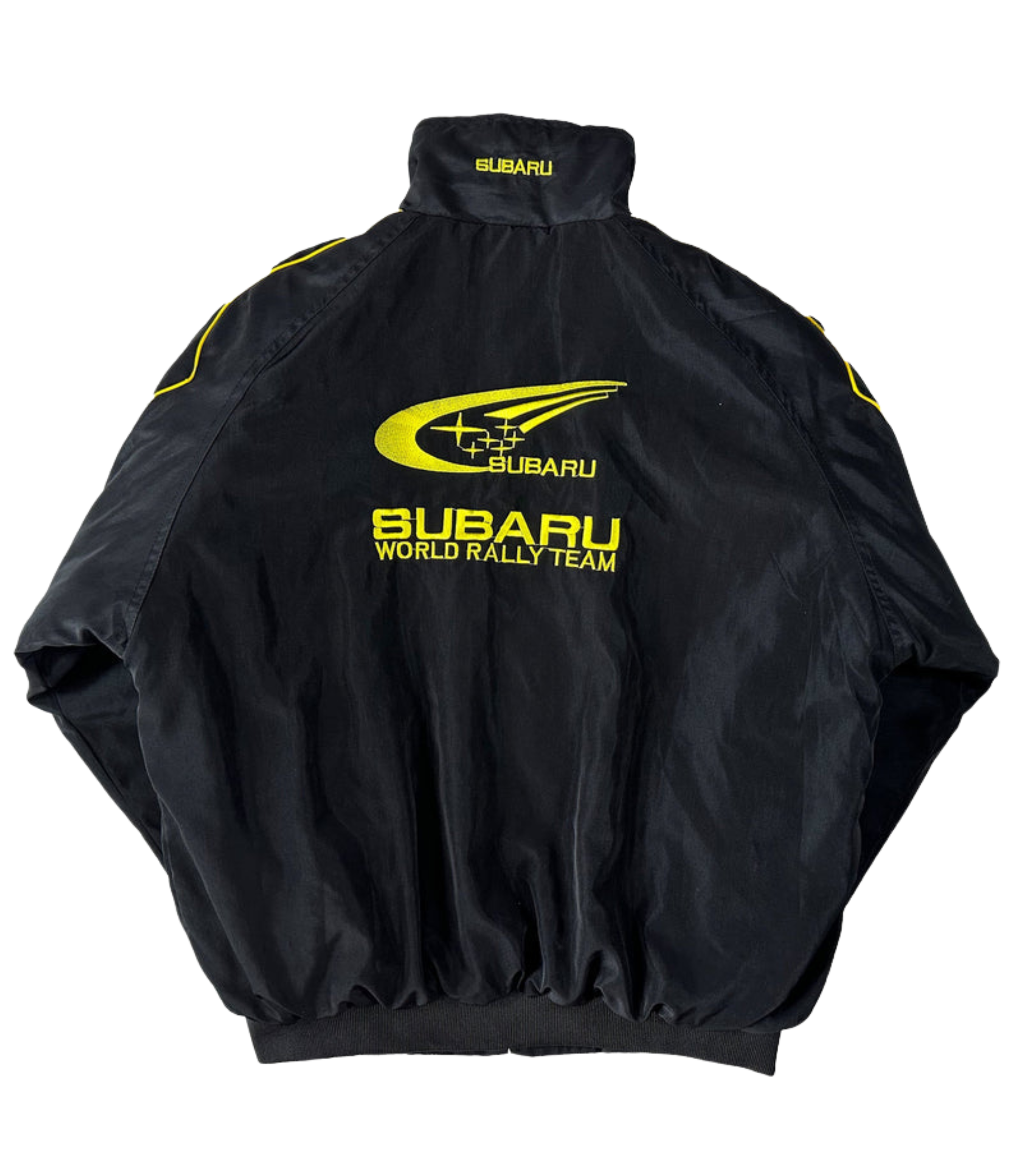 The Subaru Rally Vintage Racing Jacket features bold yellow logos and text on the back, a high collar, and elastic cuffs. The Subaru emblem and rally graphics highlight its authentic rally heritage.