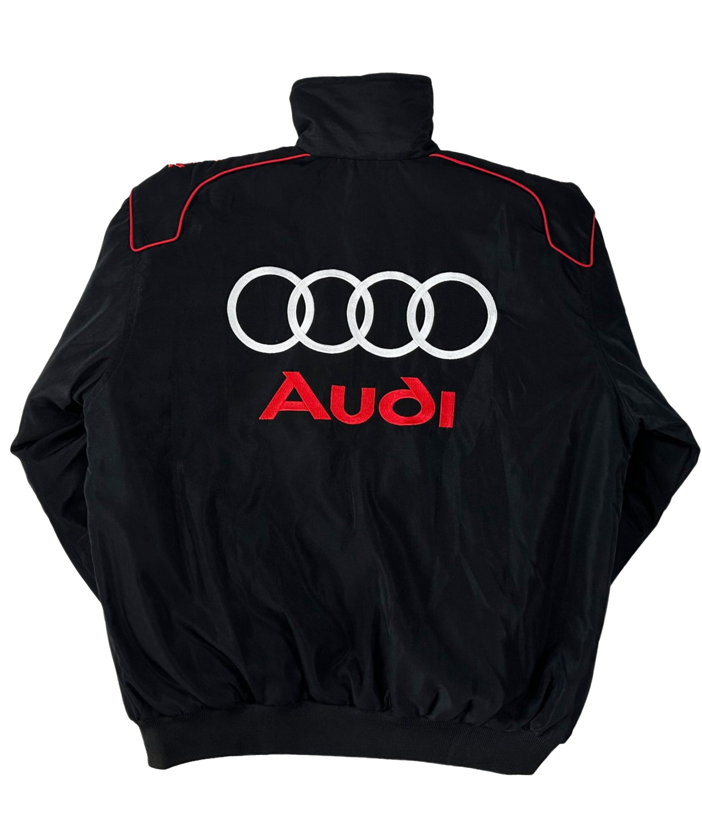 The Audi Vintage Racing Jacket is black with four white interlocking rings and red Audi embroidery on the back. Featuring a high collar, red shoulder accents, and vintage motorsport style, it celebrates Quattro heritage.