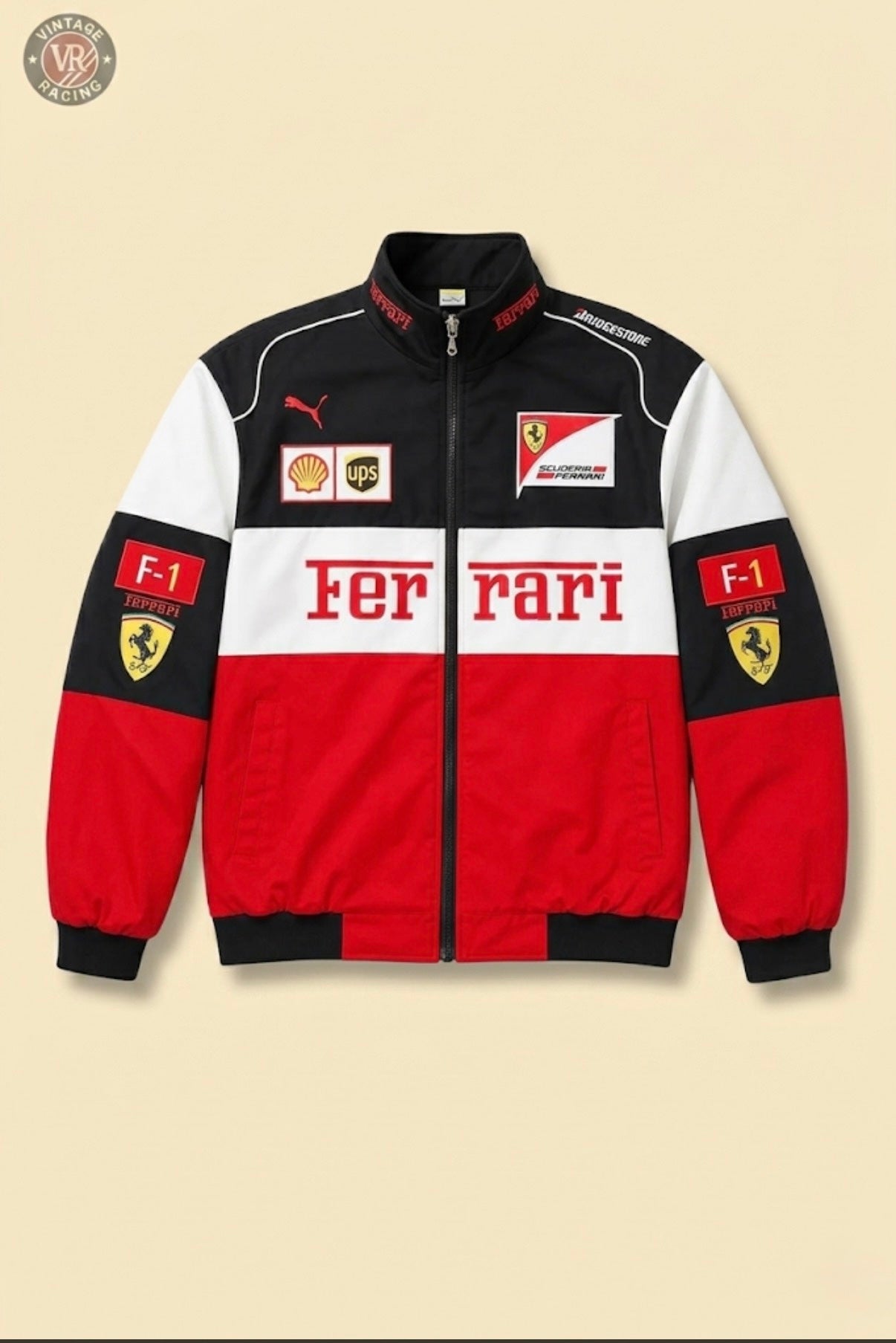The F1 Ferrari Vintage Racing Jacket - Black, White & Red Edition features Shell, UPS, Puma, and Ferrari logos with racing patches and Ferrari text on the chest and sleeves, shown on a beige background.
