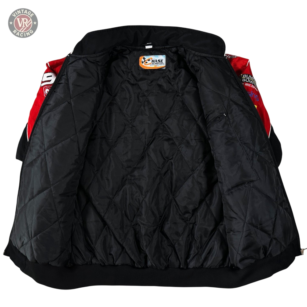A Budweiser Vintage Racing Jacket - NASCAR Black Edition with a red and black quilted outer layer is spread open on a light surface, displaying its inner lining and a Chase Authentics label at the neck.