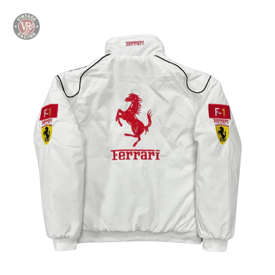 The Ferrari F1 Vintage Racing Jacket - White Edition features a large red prancing horse and Ferrari text on the back, F1 patches and Ferrari shields on the sleeves, a high collar, and black piping accents.