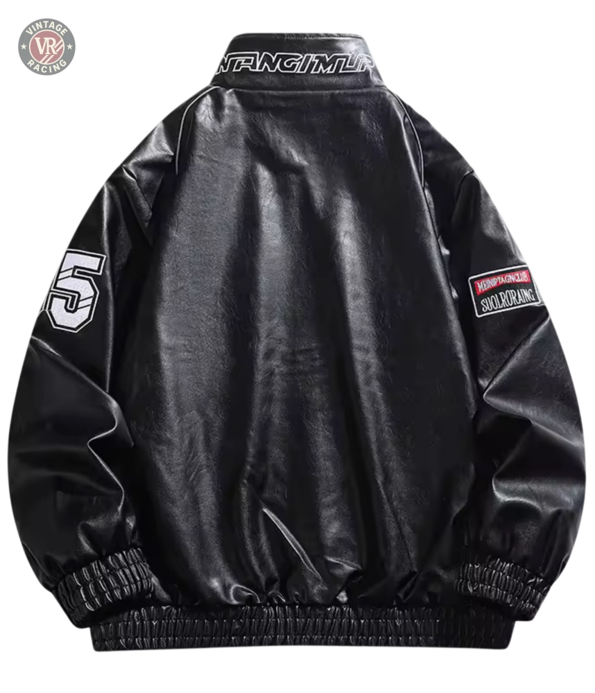 The LAP 85 Black Racing Jacket features black faux leather with a shiny finish, elastic cuffs and hem, a white 55 patch on the left sleeve, red-and-white patch on the right sleeve, and F1-inspired details for bold style.