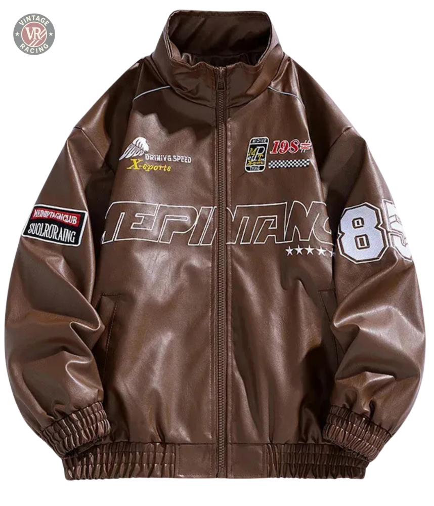 The LAP 85 Brown Racing Jacket is inspired by vintage motorsport designs, featuring white and red patches like number 85 and DRIVING SPEED, decorative front and sleeve text, plus elastic hem and cuffs for a classic 80s driver look.
