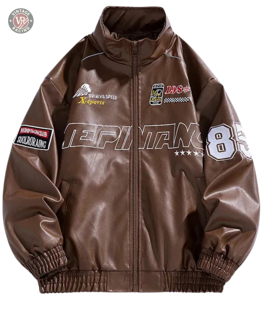 The LAP 85 Brown Racing Jacket is inspired by vintage motorsport designs, featuring white and red patches like number 85 and DRIVING SPEED, decorative front and sleeve text, plus elastic hem and cuffs for a classic 80s driver look.