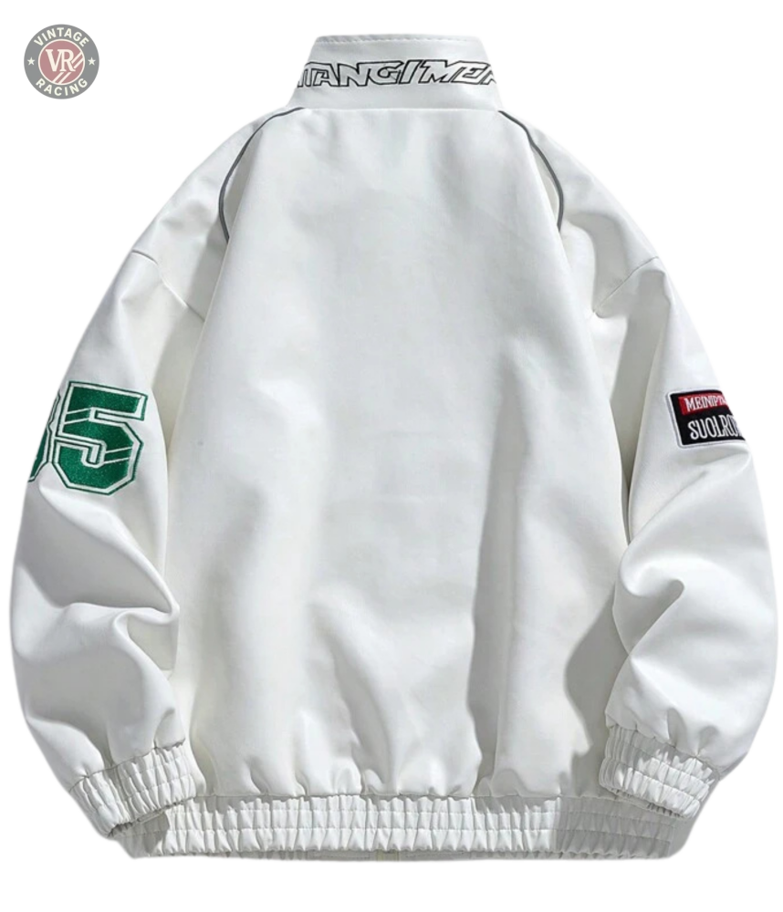 The LAP 85 White Racing Jacket features green 95 text on the left sleeve, a “MOMENT SOULCHAOS” patch on the right sleeve, and stylized collar lettering—a bold retro design with standout streetwear appeal.