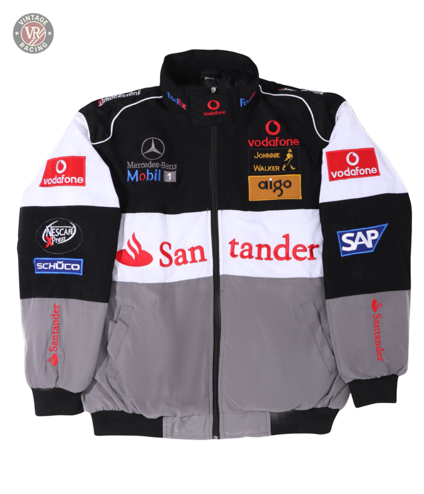 The McLaren F1 x Mercedes-Benz Vintage Jacket features black, white, and gray panels with Vodafone, Santander, SAP, Johnnie Walker, and Mercedes-Benz sponsor logos on the front, sleeves, and shoulders—a must-have for retro Formula 1 fans.