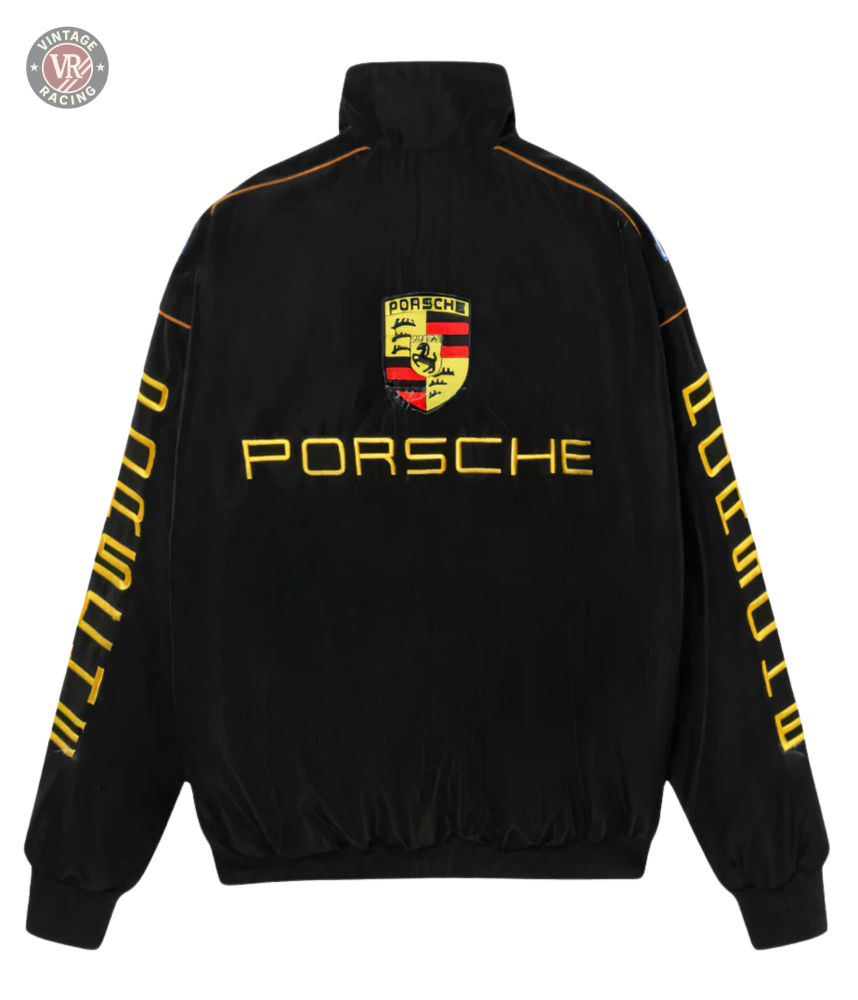 The Porsche Vintage Racing Jacket is black with yellow “Porsche” text on the back and sleeves plus a large Porsche logo on the upper back—ideal for retro motorsport jacket enthusiasts and fans of authentic trackside style.