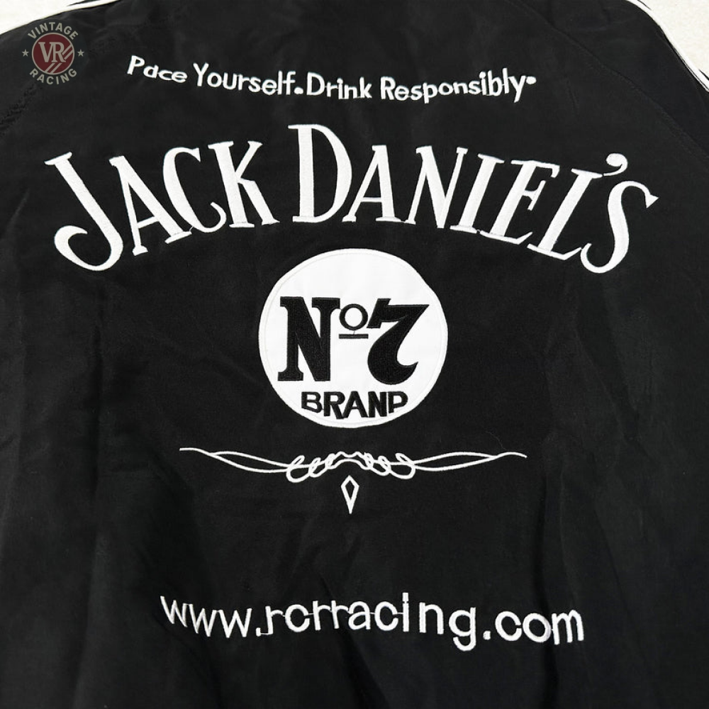 The Sponsored’s Racing Vintage Jacket features black fabric with white text: "Pace Yourself. Drink Responsibly. JACK DANIEL’S No. 7 BRAND" and www.jcrracing.com, plus a central Jack Daniel’s logo for streetwear-meets-motorsport style.
