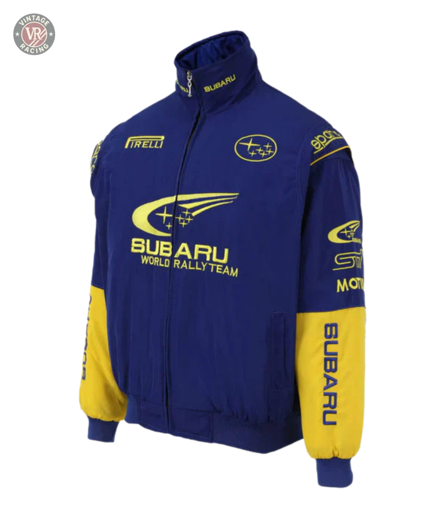 The Subaru World Rally Team Vintage Jacket features blue and yellow 555 livery, logos, and text on the front, sleeves, and collar. It has a zip closure with ribbed cuffs and hem for a classic look.