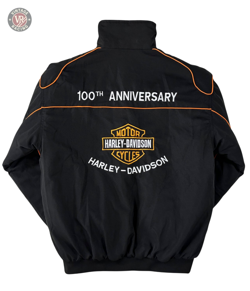 Vintage Harley Davidson Jacket with orange piping, 100th ANNIVERSARY detail, and the classic Harley-Davidson logo on the back—a must-have retro motorcycle jacket for enthusiasts.