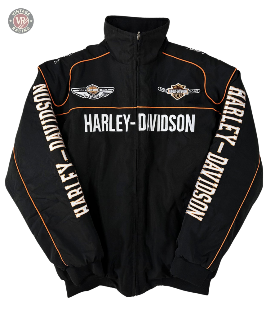 The Vintage Harley Davidson Jacket is black with orange piping and embroidered logos, featuring HARLEY-DAVIDSON across the chest and sleeves. This retro motorcycle jacket has a zip-up front and high collar for classic biker style.